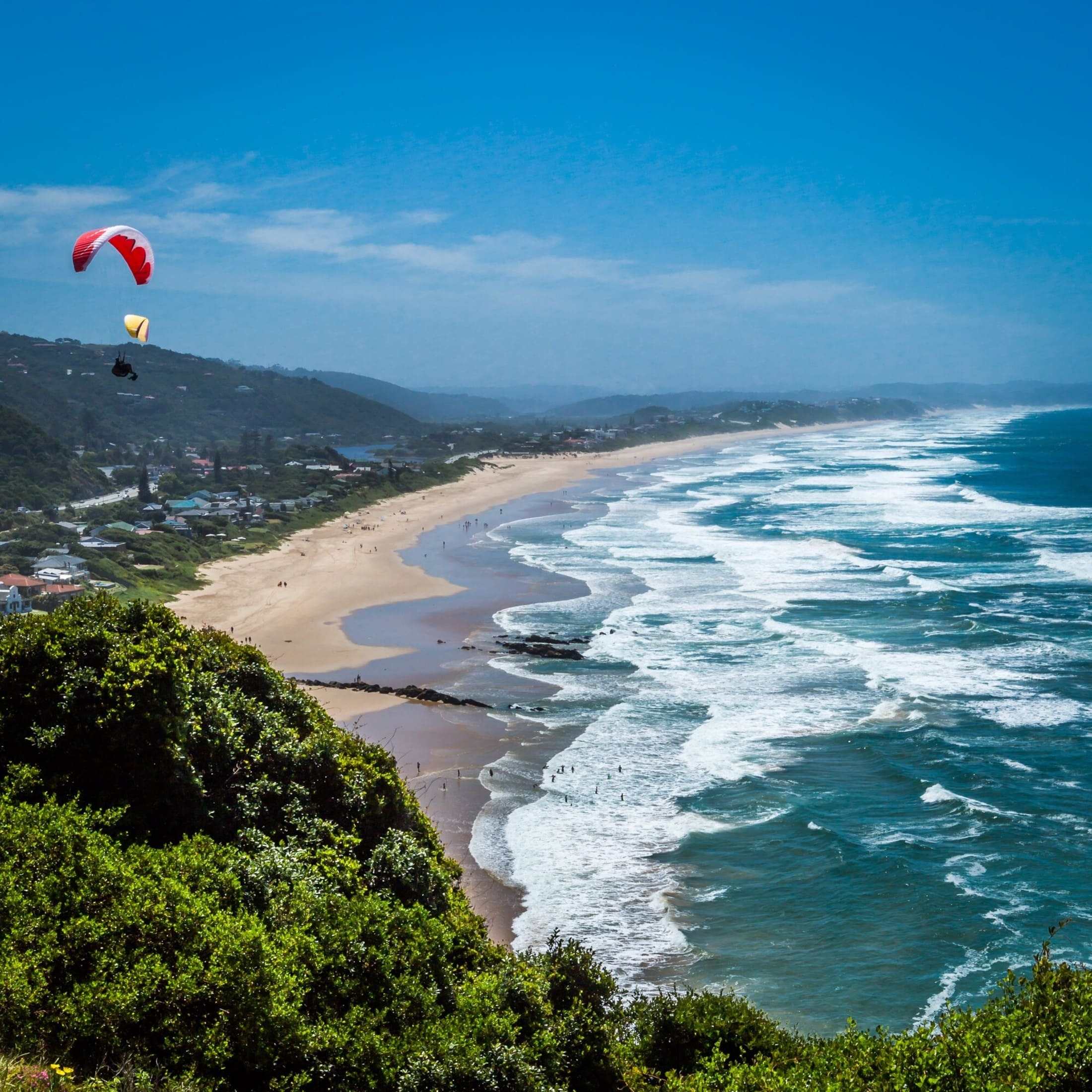 Paragliding over a beach