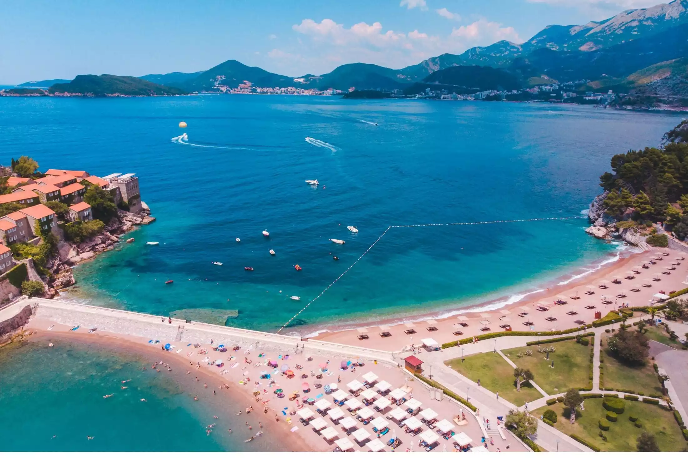 A picture of Sveti Stefan Beach that sits in front of the isle with the same name