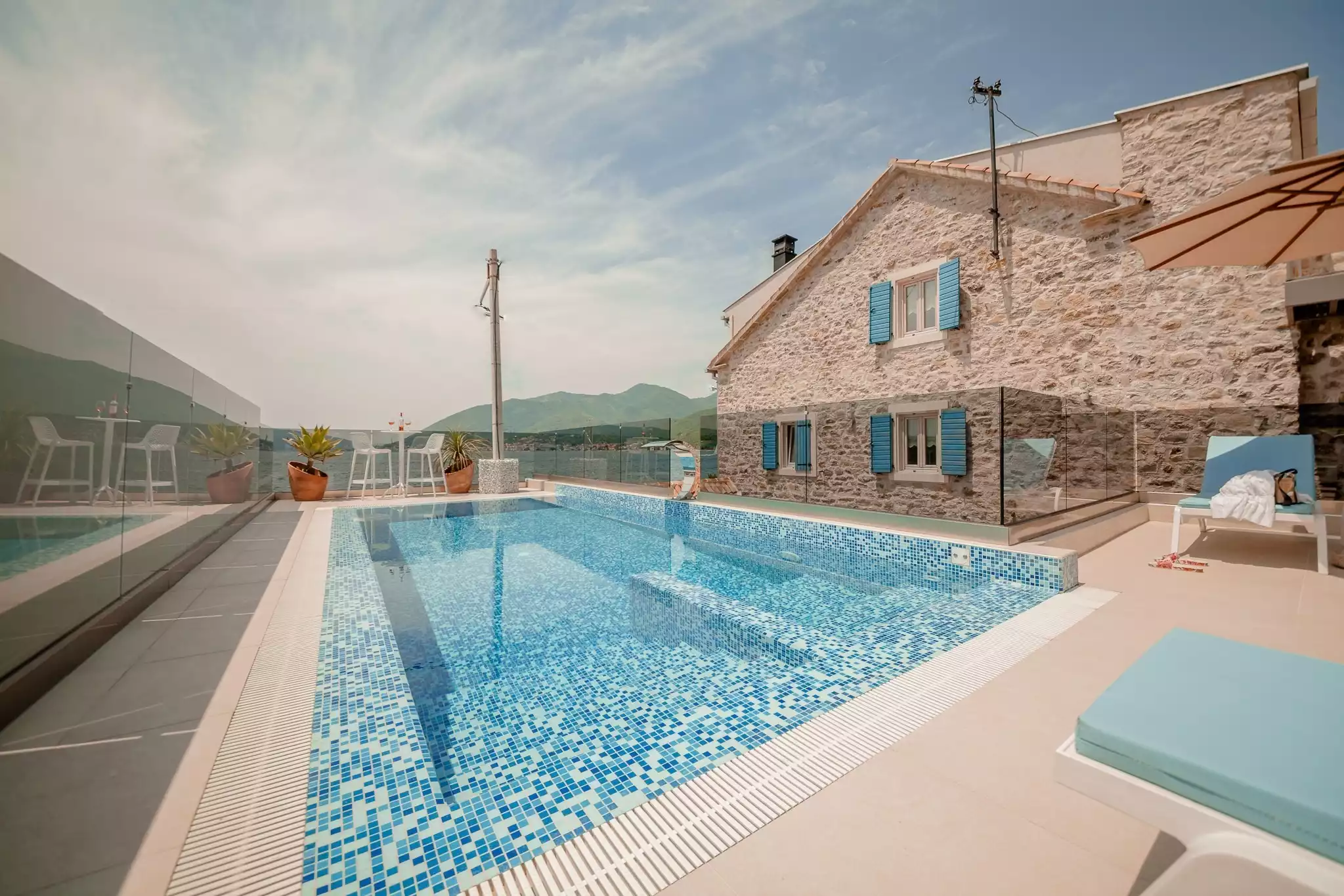 A photo of an outdoor pool in Montenegro, part of a luxury villa for rent