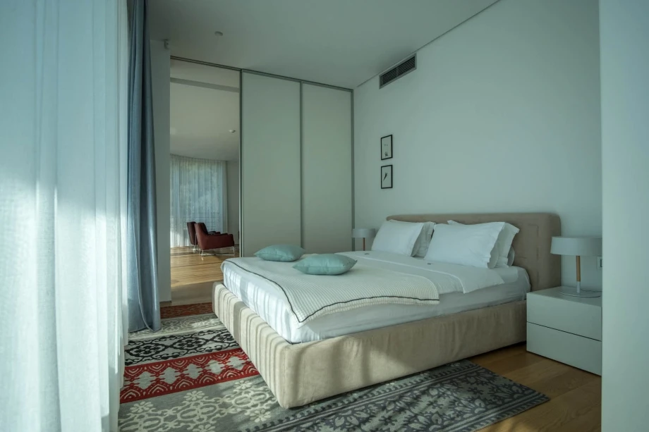 Cosy bedroom with a king size bed in Budva