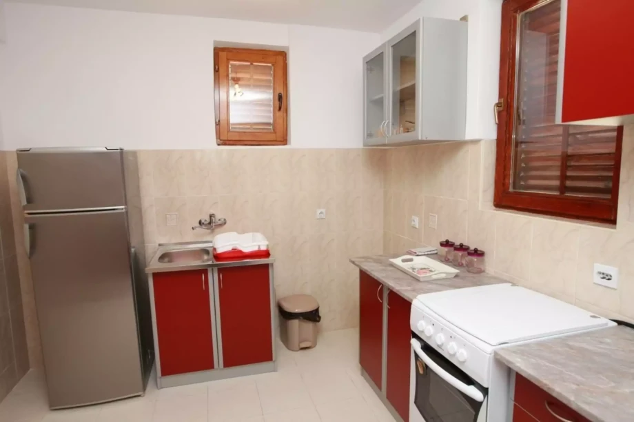 A photo of a fully equipped kitchen in Villa Sveti Stefan in Budva