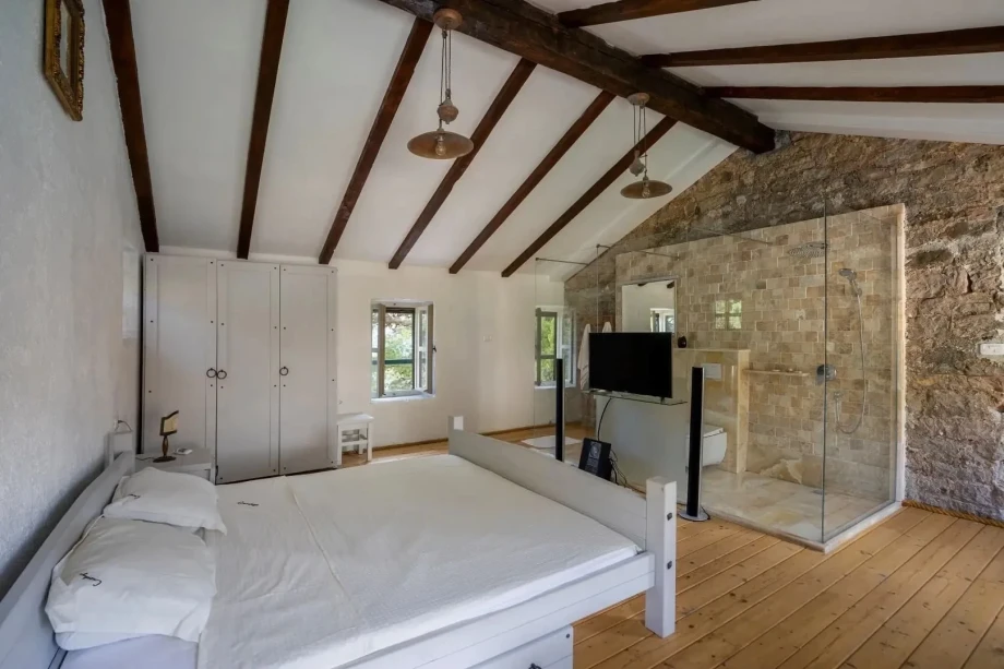 Elegant View of a Spacious Bedroom with Natural Light