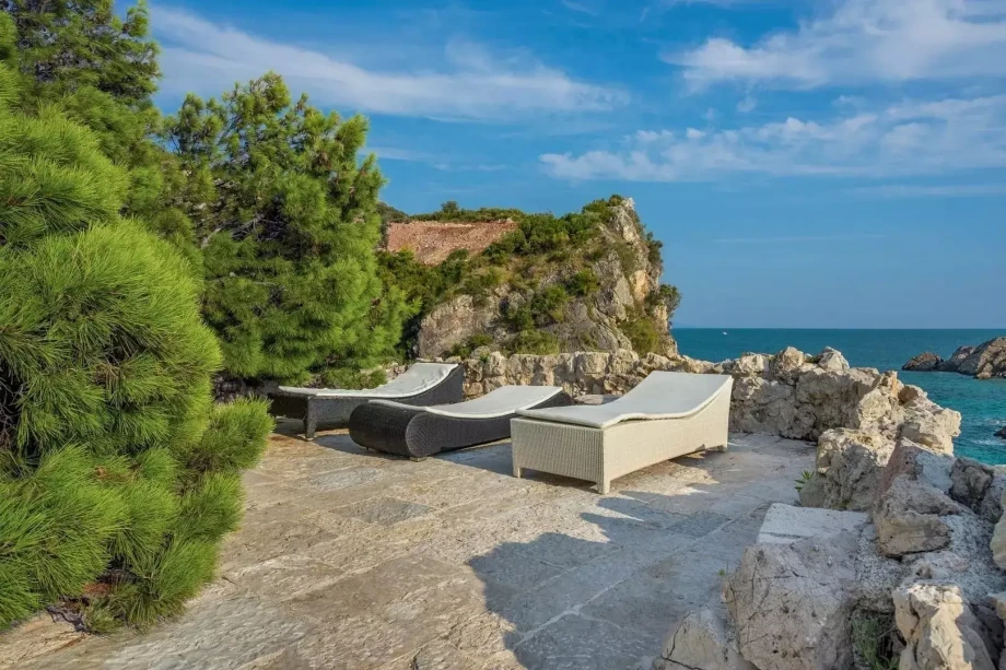 Luxury Villa with Sundeck Chairs Overlooking Scenic Montenegro Landscape
