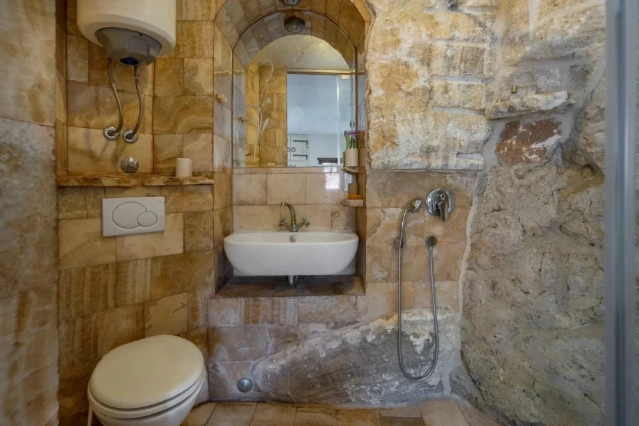 Rustic Bathroom in Montenegro Villa Featuring Stone Accents and Warm Earthy Tones