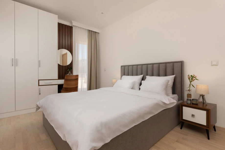 Cozy Bedroom for Two with Elegant Decor and Comfortable Bedding