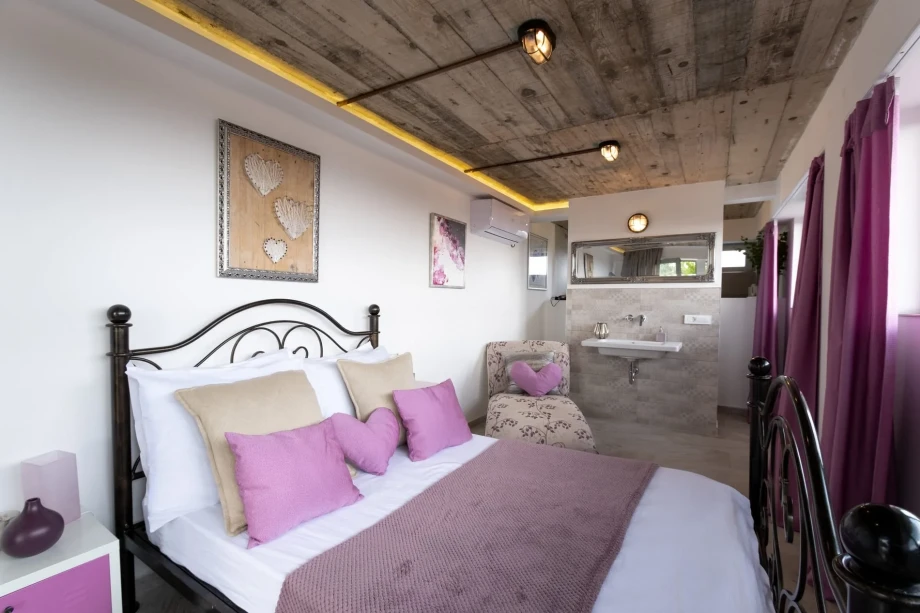 Family-Friendly Bedroom with Double Bed and Armchair at Villa Infinity, Montenegro