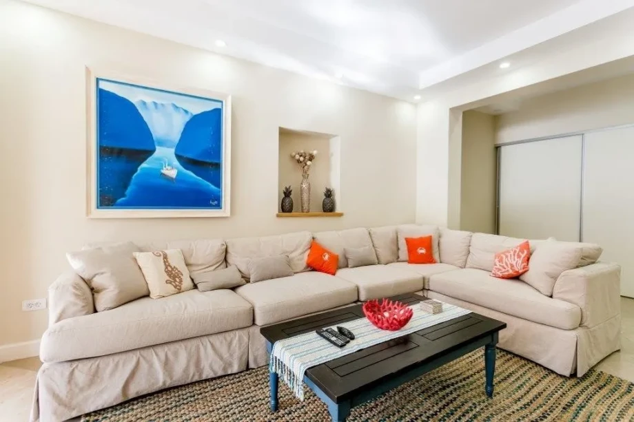 A living room with a huge corner sofa inside a villa in Montenegro