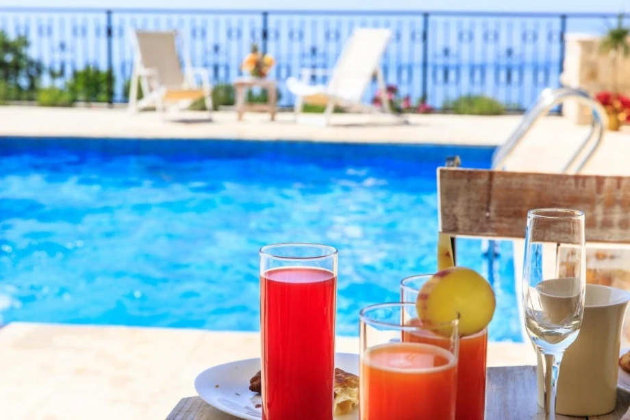 Outside pool with Sun Loungers at Villa Tulip