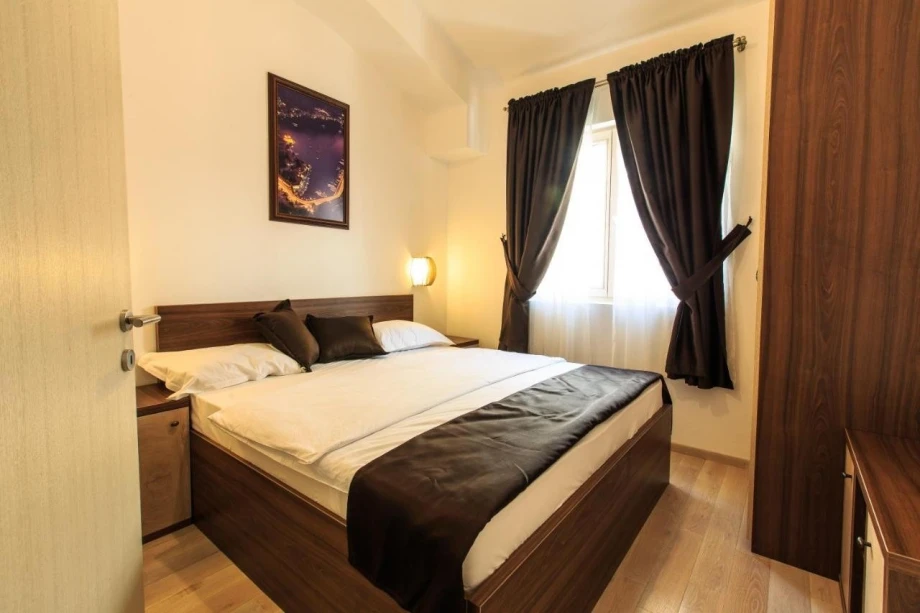 Luxury bedroom with black details in villa for rent Montenegro