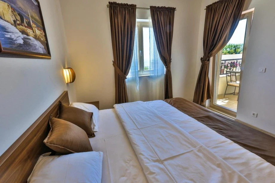 Bedroom with huge bed for two in luxury villa