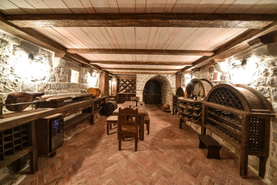 Wine cellar with wine tasting table in Classic Estate Villa with Pool and Gym in Kotor