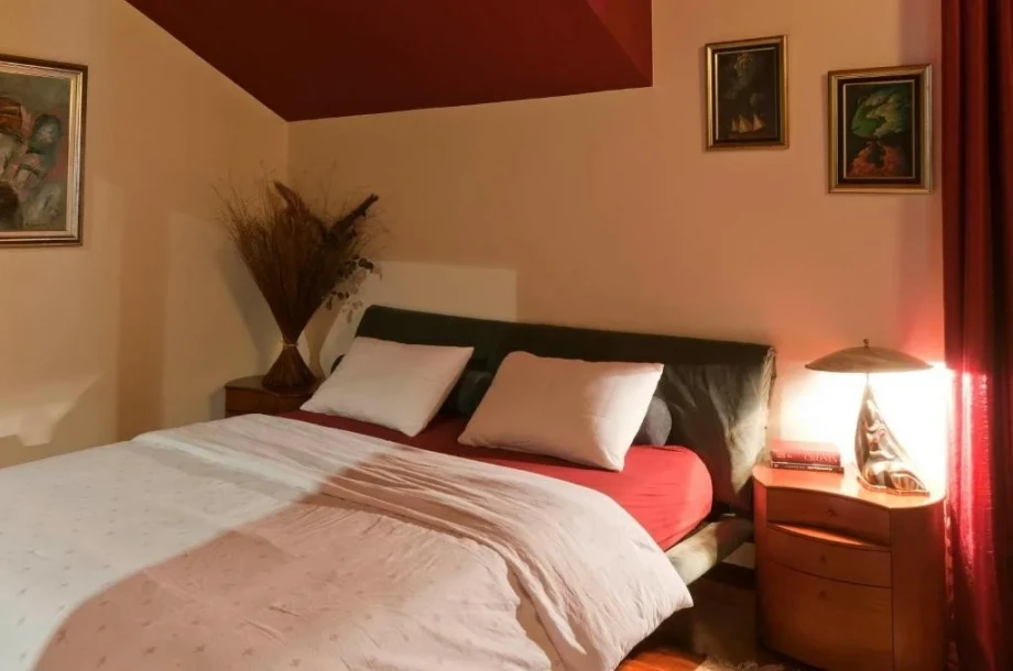Bedroom with red decor in a Montenegro villa rental