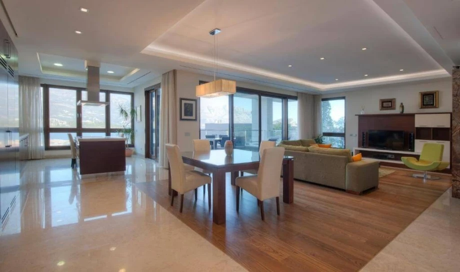 Dining table and living room in a familly villa in Montenegro
