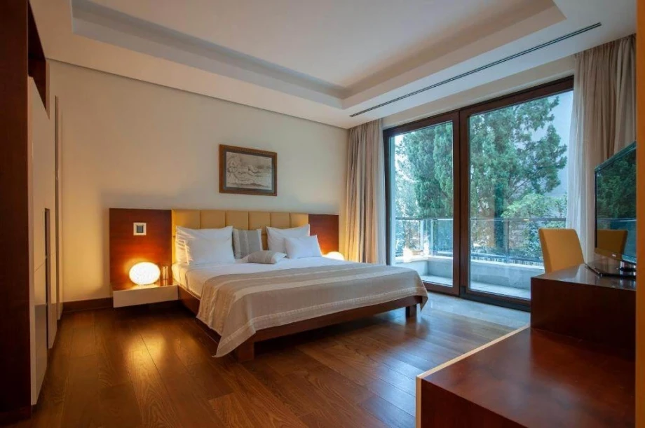 Bedroom for two with a double bed and terrace access in Budva villa