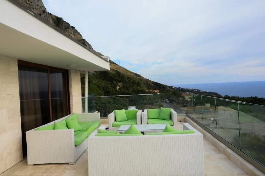 Outdoor lounge area inside an elegant villa for rent in Budva