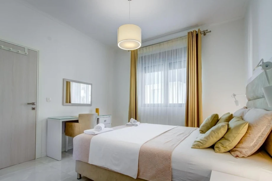 Bright and minimalistic bedroom inside a Montenegro villa in Budva