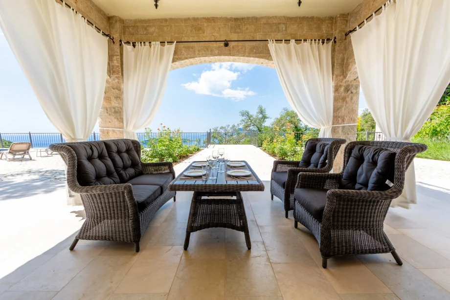 Outdoor dining and relaxation area in a villa in Montenegro