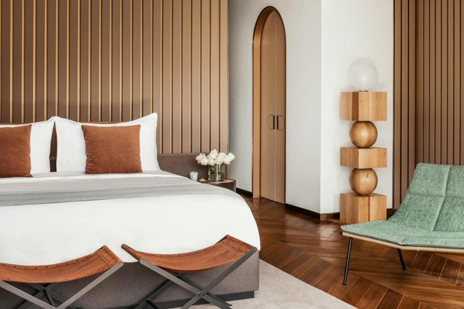 Modernly equipped luxury room for two with a lamp and an armchair, luxurious villa in Portonovi