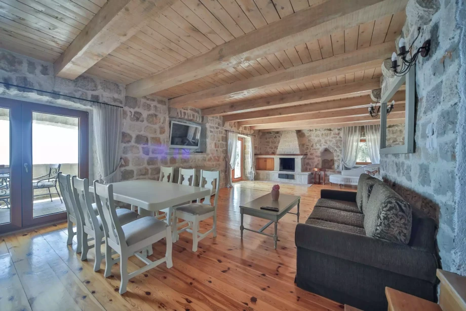 Spacious and elegant living room with fireplace in a Montenegro villa for rent