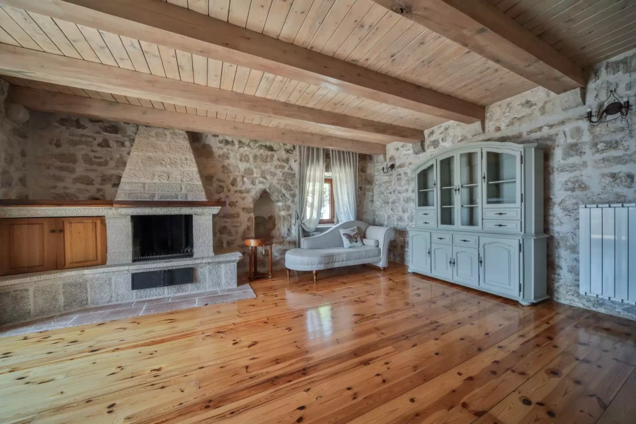 Spacious living room with fireplace in luxury Charming villa for rent in Montenegro