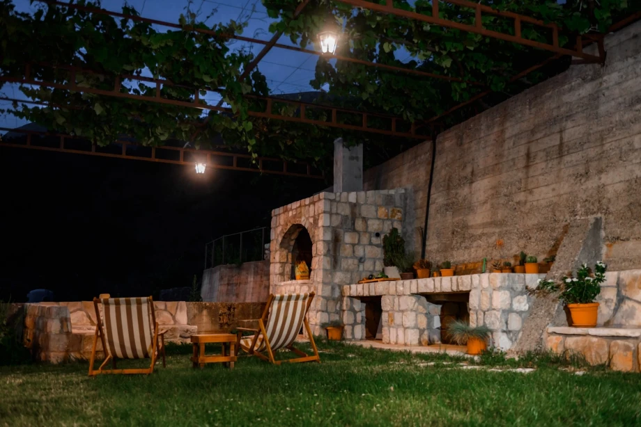 Rustic garden and a fireplace in Villa Sunray, Budva