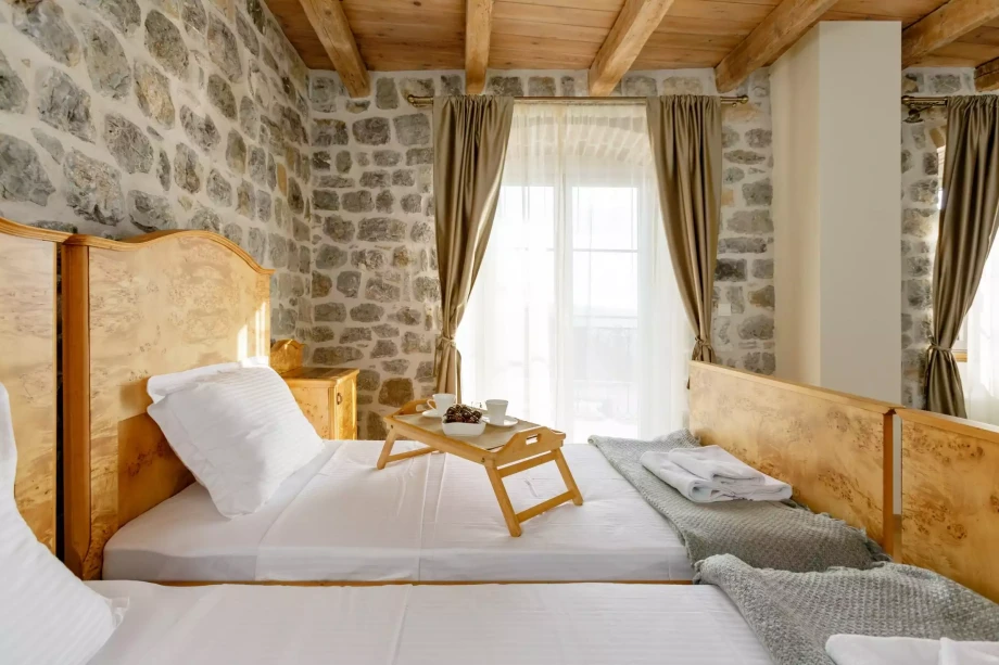 Bedroom with two beds in luxury villa for rent in Kotor