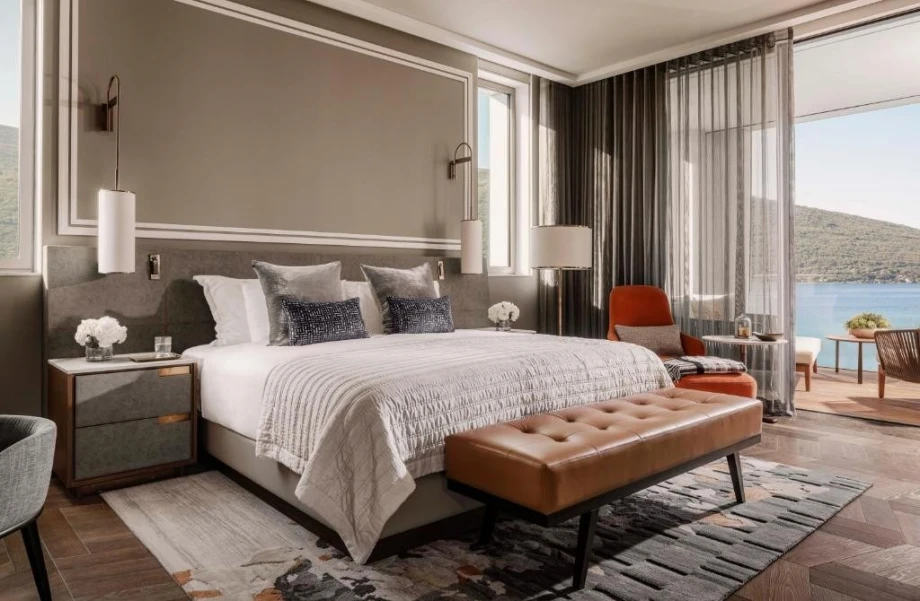 Modernly equipped luxury room with panoramic window and terrace
