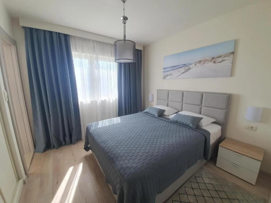 A room for two people in the Endless Blue Villa with blue details and a comfortable large bed