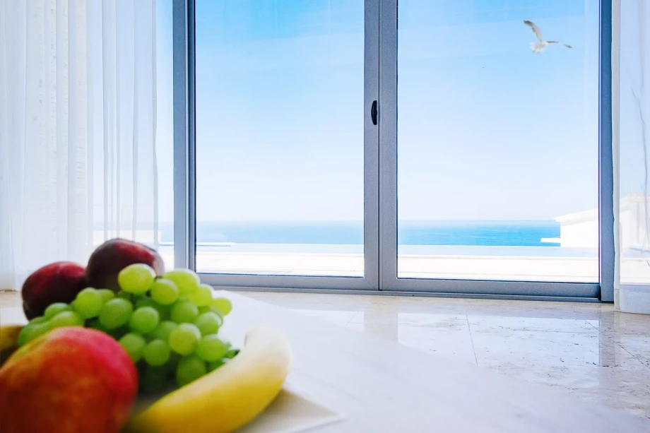 Variety of fruit and a fantastic view of the Adriatic sea from inside a villa in Montenegro