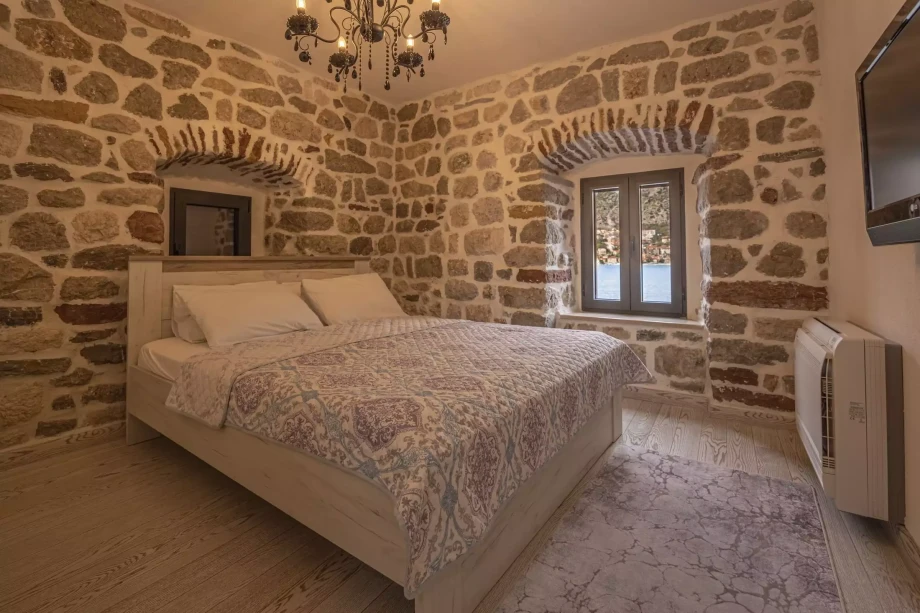 Beautifully decorated room for two with rustic stone walls