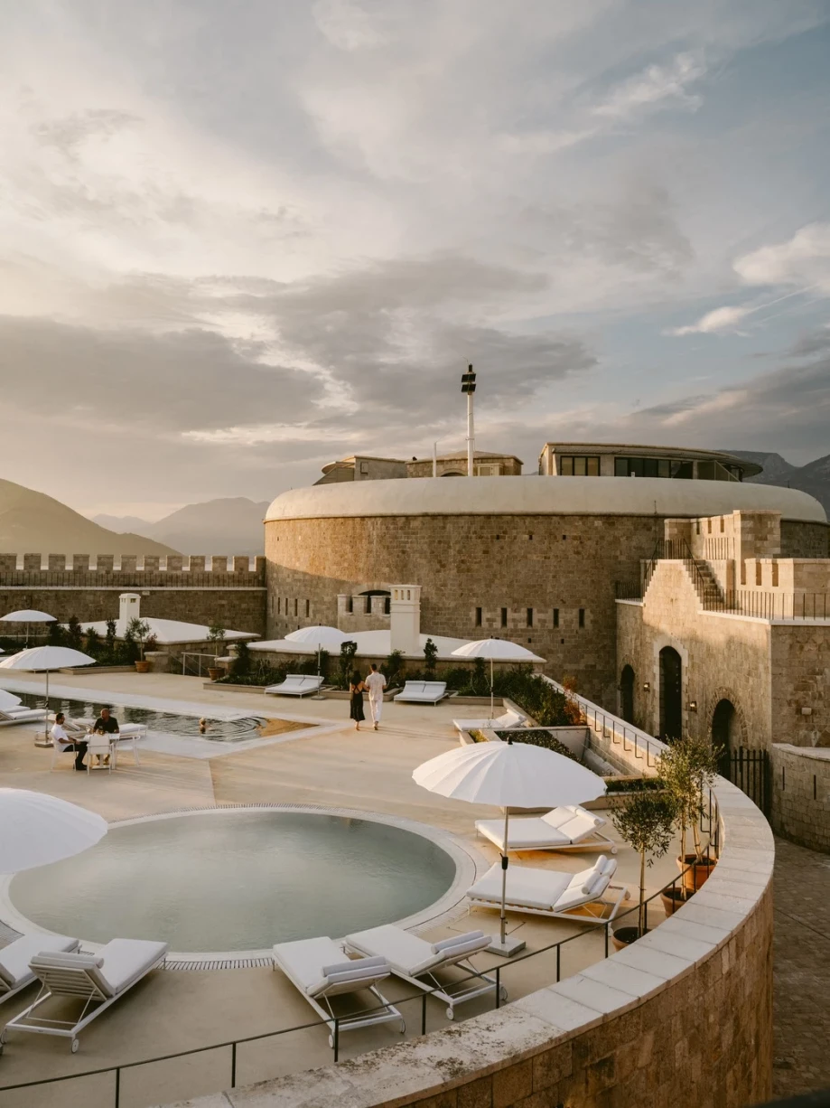 Pools with sun decks and sun umbrellas