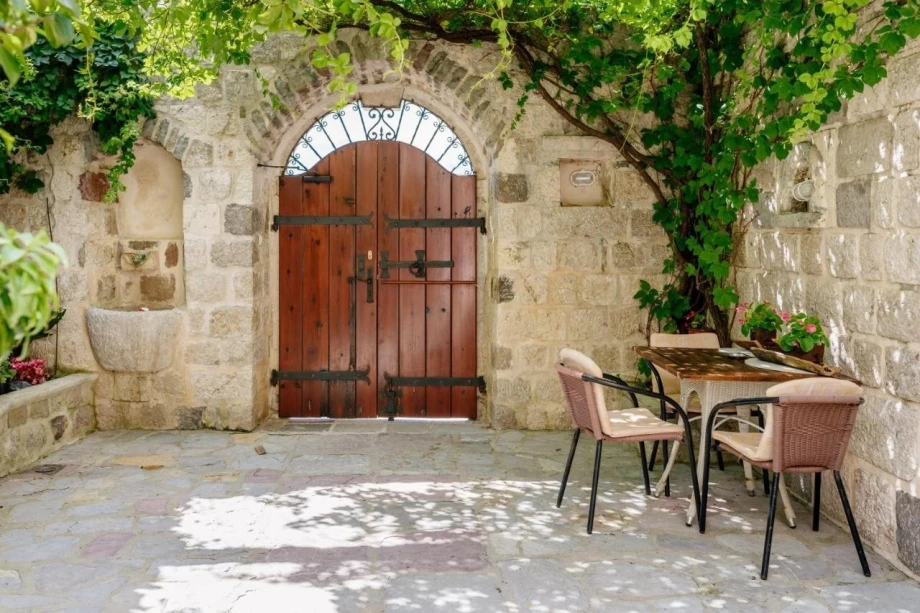 Rustic wooden front gate of Seafront Bliss Villa in Kotor
