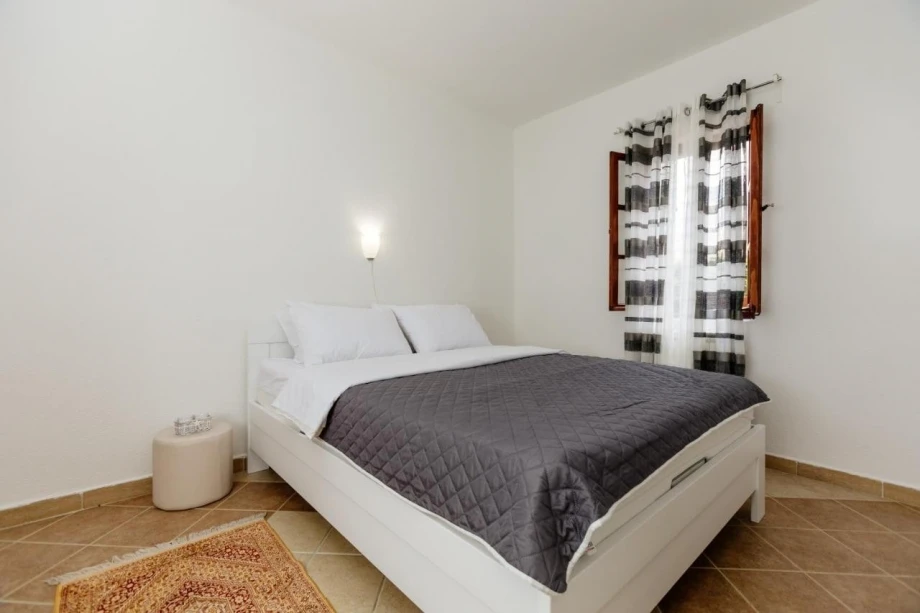 Large bedroom with double bed for in a villa for rent in Kotor