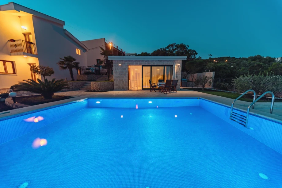 Azure blue pool of a Montenegro luxury villa during nighttime