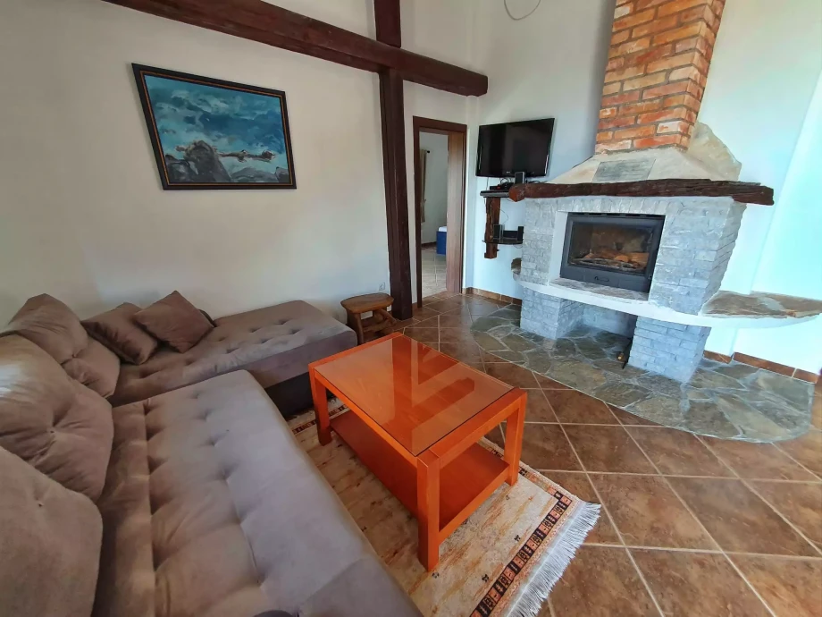Cozy living room with a fireplace inside a Montenegro villa rental