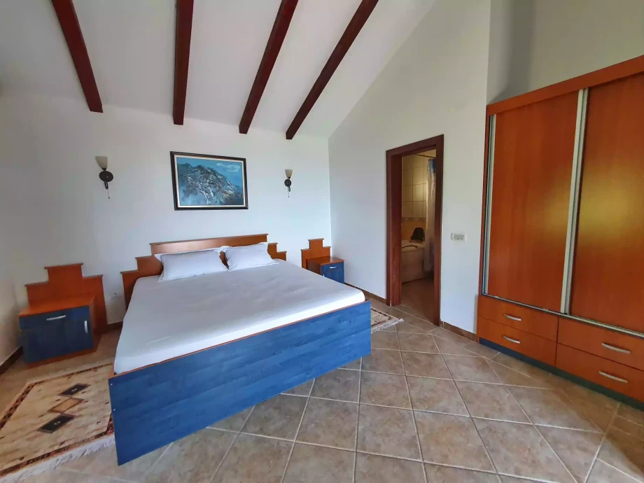 Bright comfortable bedroom in a Kotor villa