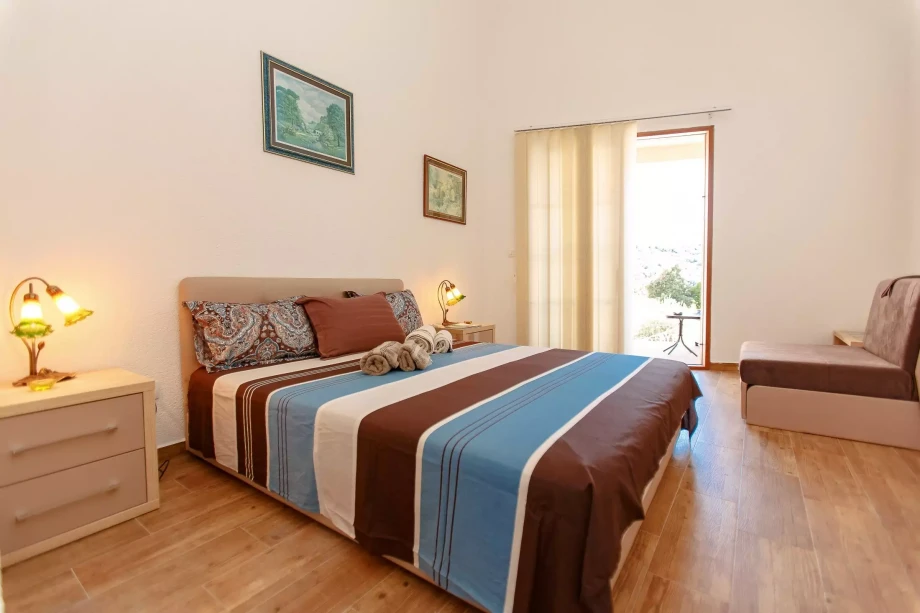 Cozy Guest Bedroom with Comfy Linens and Soothing Color Palette at Villa Meringue in Bar