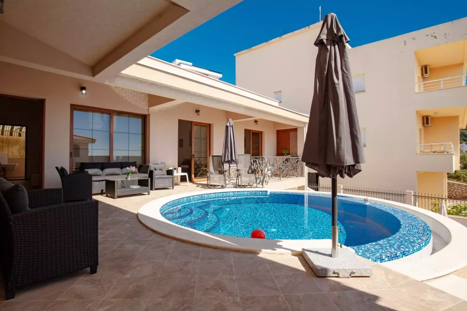 Expansive Patio Area for Outdoor Dining and Relaxation with Outdoor Pool at Villa Meringue