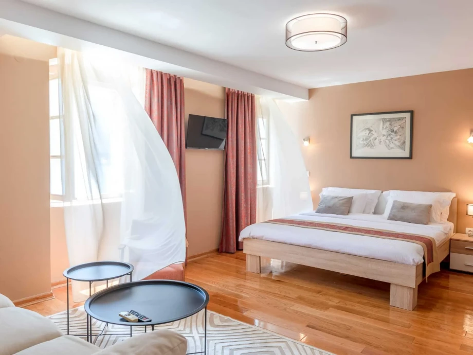 Bright bedroom with king size bed