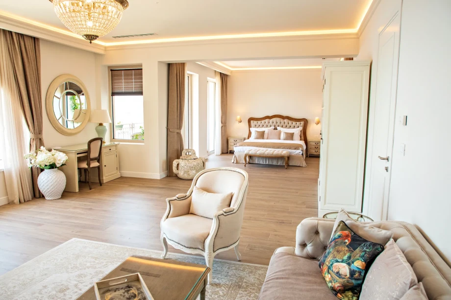 Modern bedroom with king bed and sofa