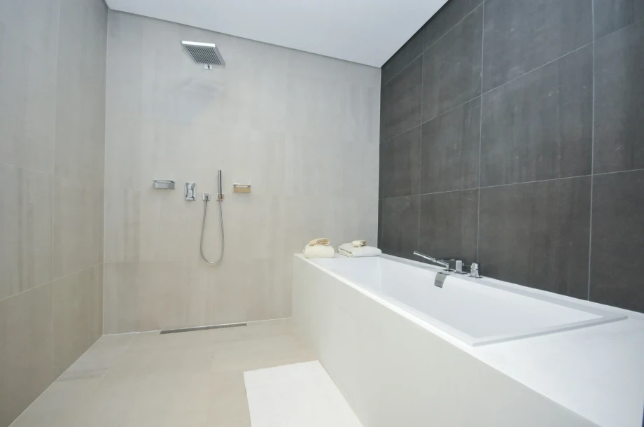 Bathroom with bathtub and shower