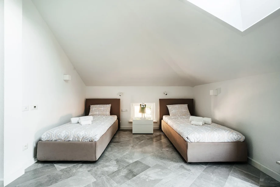 Luxurious Bedroom with Two Beds in Spacious Villa