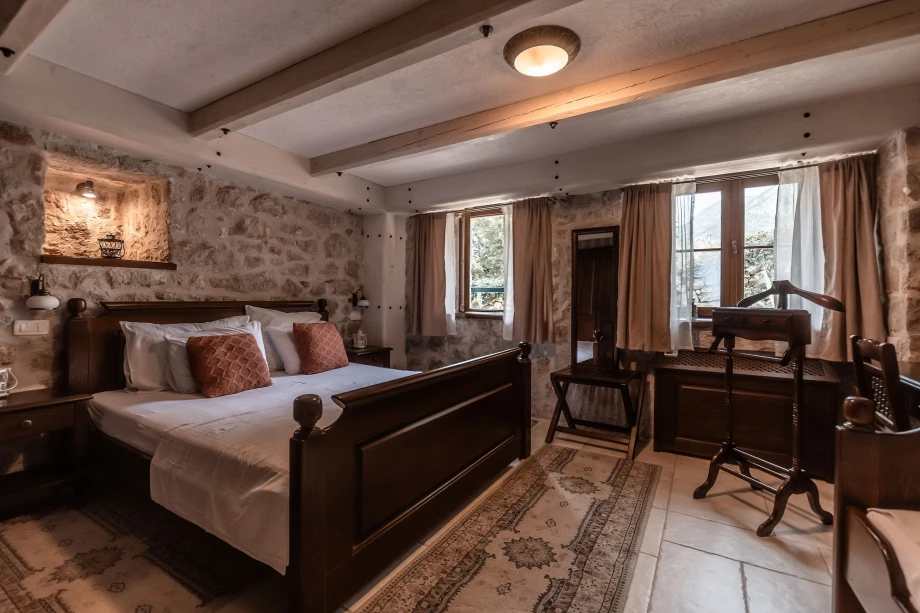 Cozy Bedroom with Stone Walls at Villa Andjelija
