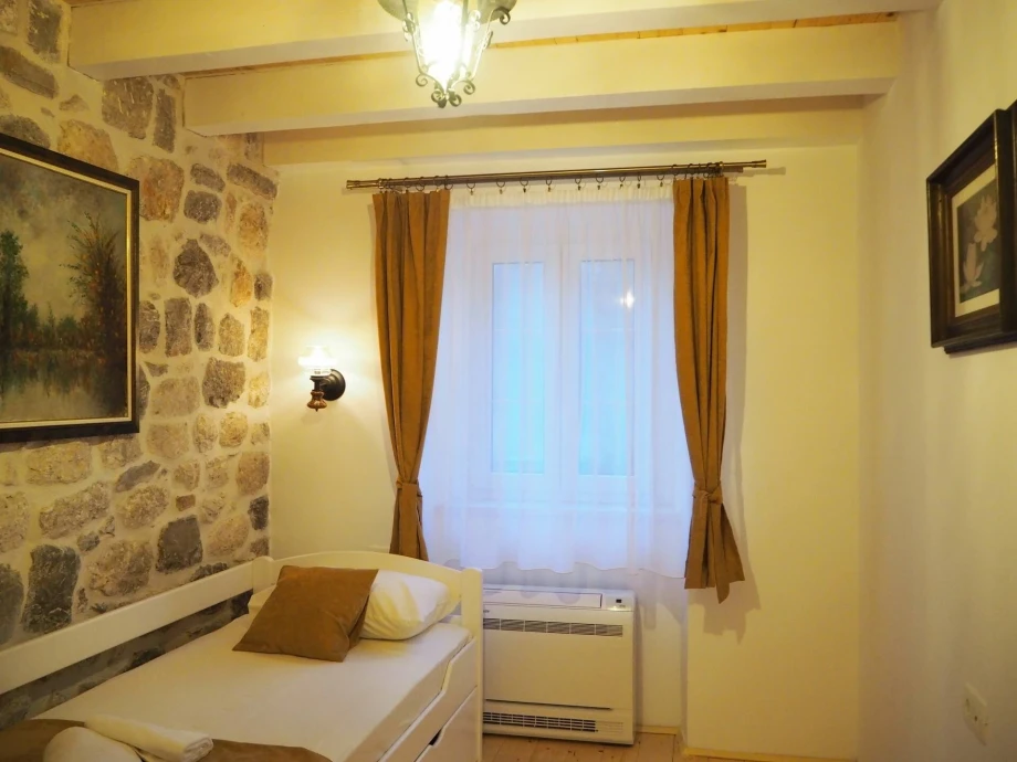 Vintage Decoration in a Cozy Montenegro Villa Bedroom