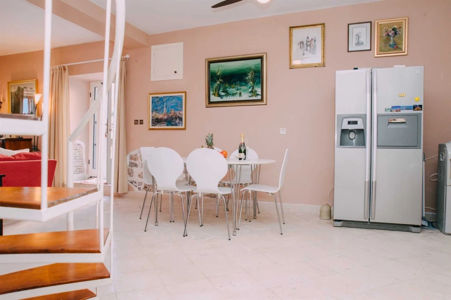 Spacious Dining Room with Stylish Furnishings and Plenty of Natural Light