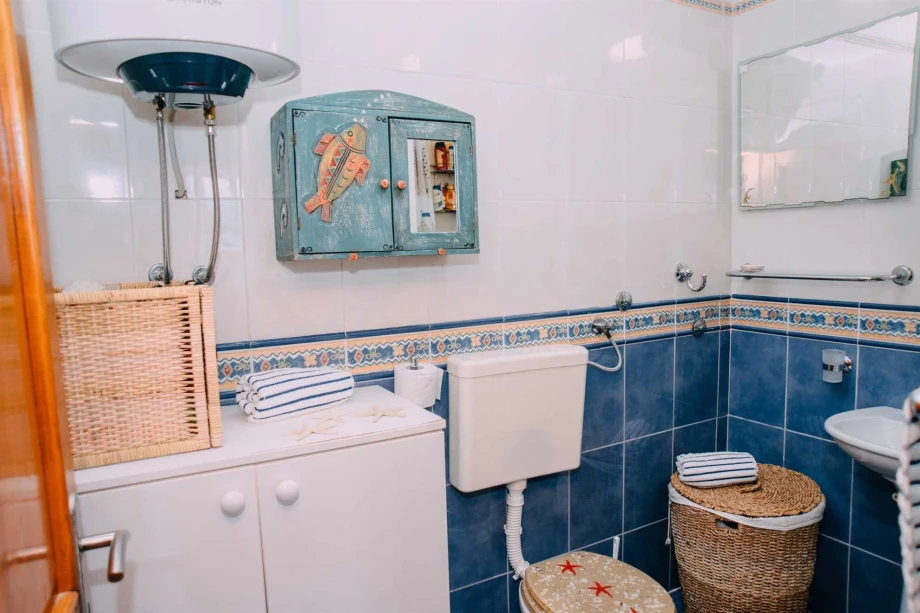 Bathroom with Mediterranean Details Featuring Vibrant Tiles and Coastal Charm