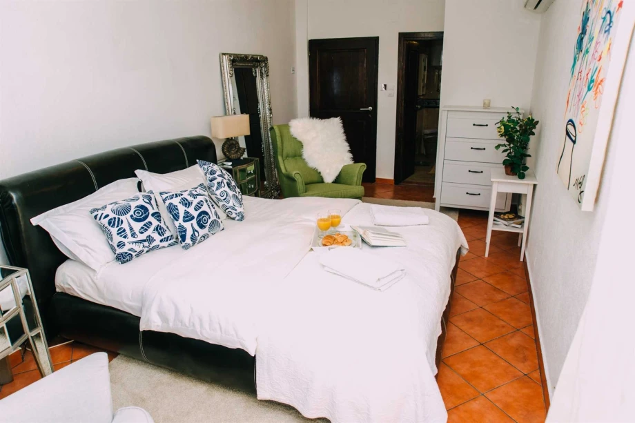 Spacious Room with Elegant Furnishings and Ample Natural Light