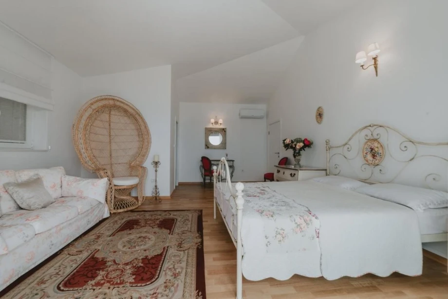 Bedroom with King Size Bed and Sofa in Villa