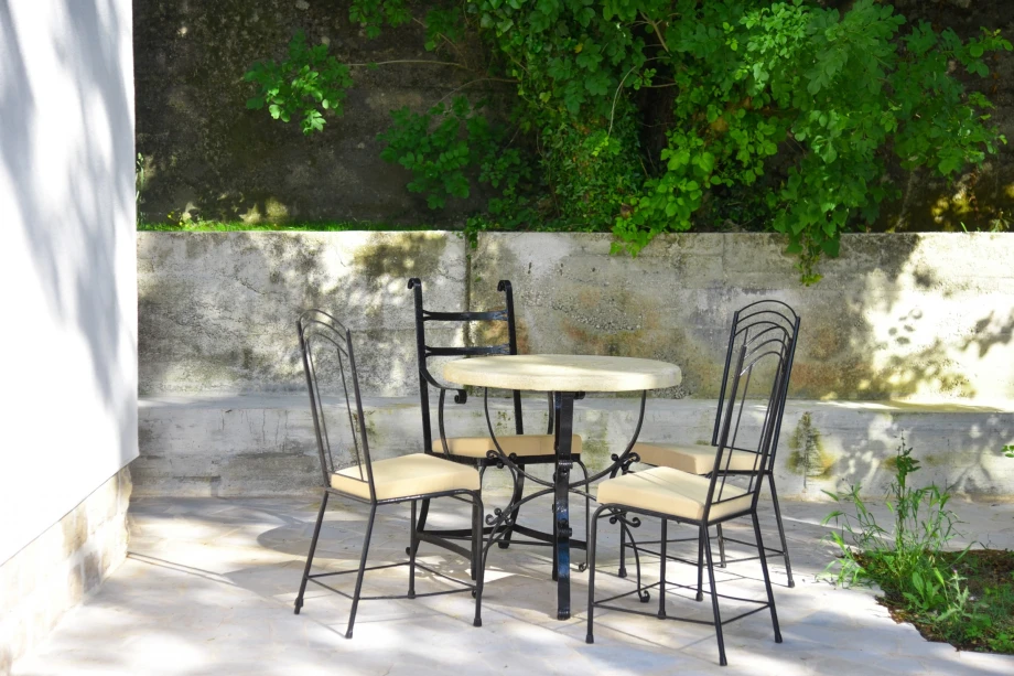 Garden table and chairs for outdoor dining at the villa