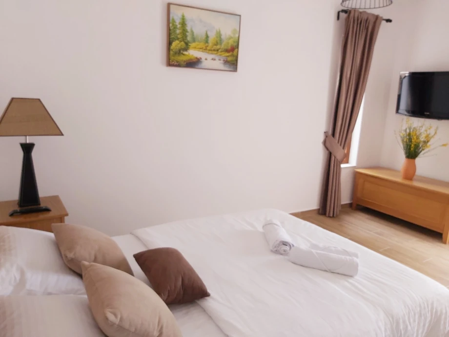 Cozy bedroom with double bed and modern design